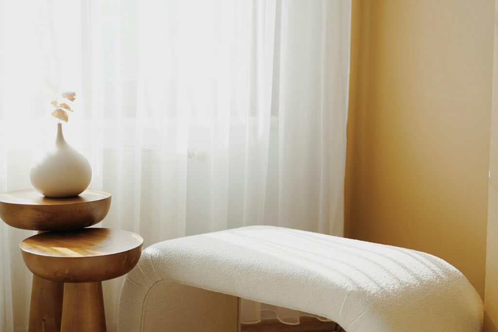 A calm, uncluttered studio interior in warm neutral tones